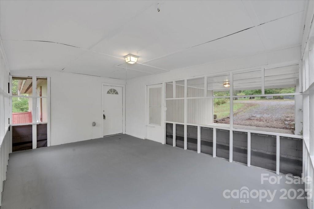 62 Kinard Lane Penrose, NC 28766 - Photo 6 of 25 a view of an empty room with a window