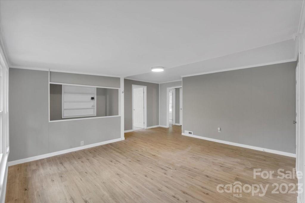 62 Kinard Lane Penrose, NC 28766 - Photo 8 of 25 a view of an empty room with wooden floor