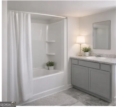 a bathroom with a bathtub and a sink