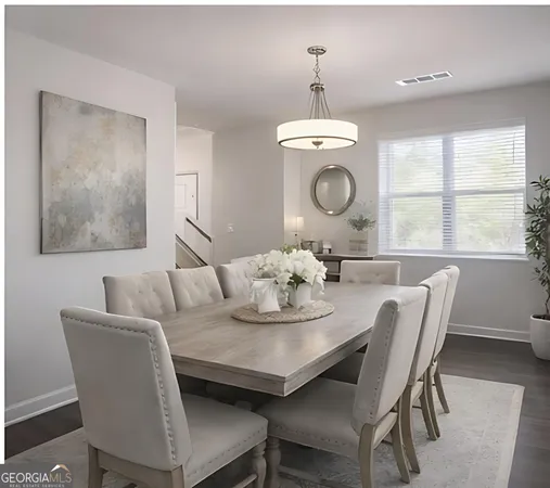a view of a dining room with furniture and window