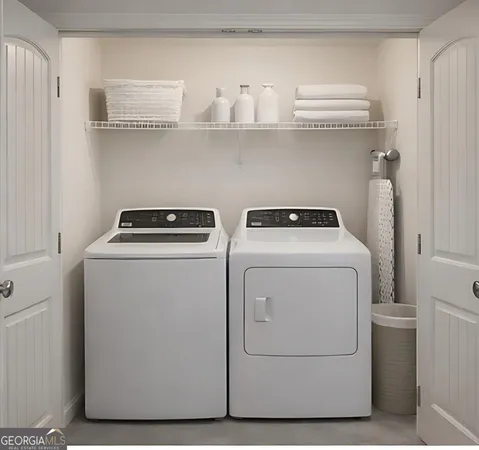 a utility room with dryer and washer