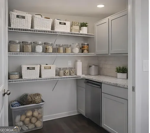 a kitchen with stainless steel appliances granite countertop a sink and wooden cabinets