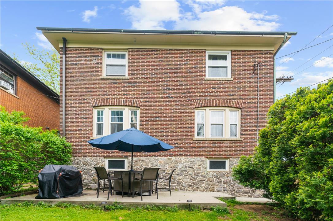 2055 Ferry Street Wilson, PA 18042 - Photo 20 of 21 This classic brick exterior offers a charming patio area, perfect for relaxed outdoor living.