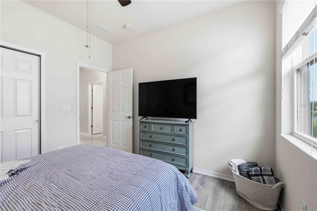 10920 79th Street East Parrish, FL 34219 - Photo 25 of 73 a bedroom with a bed and a flat screen tv