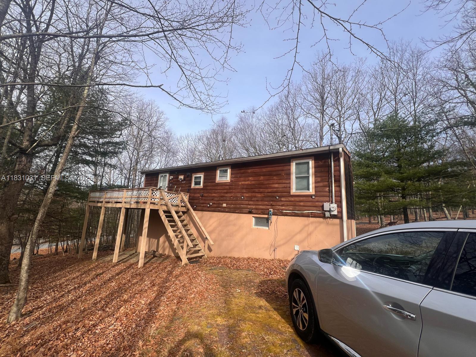 123 Rocky Road Lackawaxen, PA 18435 - Photo 1 of 39 a view of backyard with swimming pool and seating space