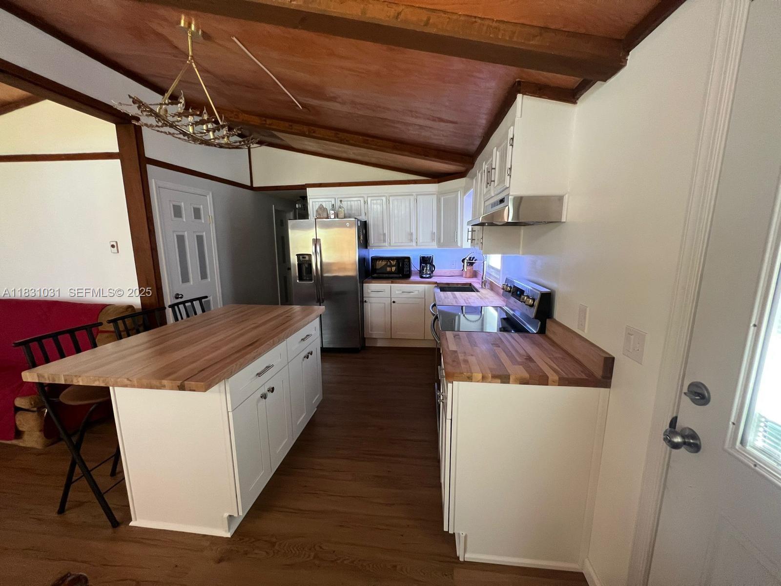 123 Rocky Road Lackawaxen, PA 18435 - Photo 22 of 39 a kitchen with stainless steel appliances granite countertop a sink a stove and a refrigerator