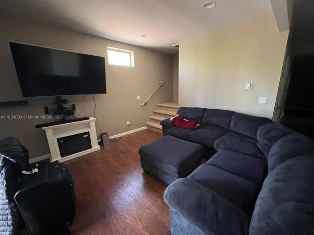 a living room with furniture and a couch