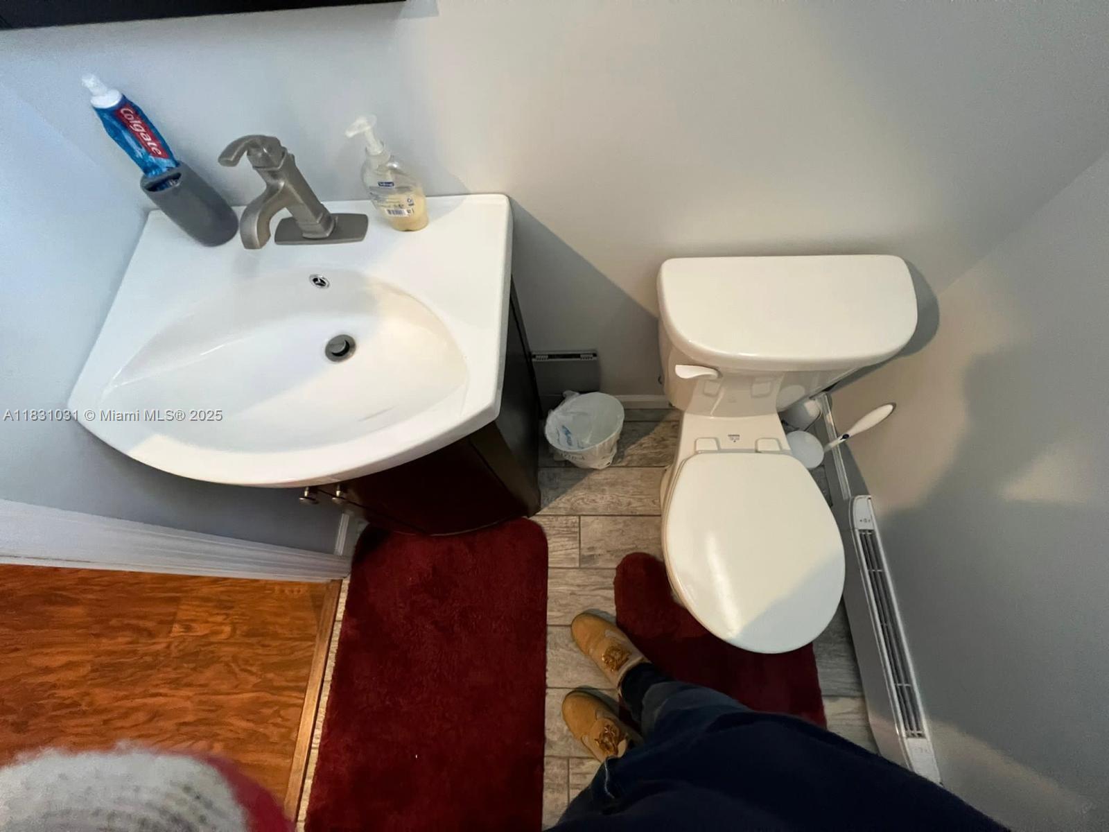 123 Rocky Road Lackawaxen, PA 18435 - Photo 30 of 39 a bathroom with a toilet sink and mirror