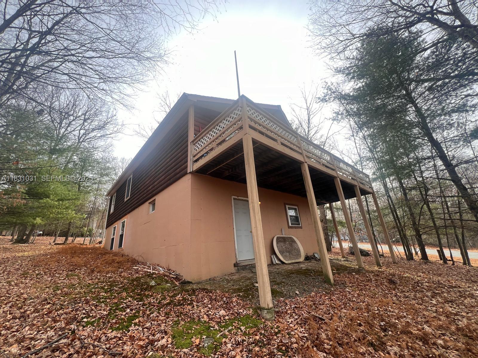 123 Rocky Road Lackawaxen, PA 18435 - Photo 3 of 39 a front view of a house with a yard