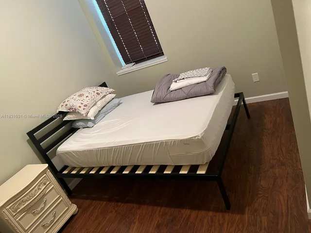 a room with furniture and a large window