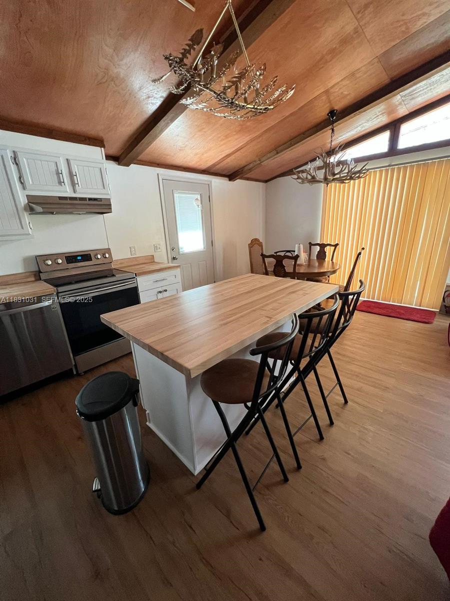 123 Rocky Road Lackawaxen, PA 18435 - Photo 35 of 39 a view of a dining room with furniture window and wooden floor