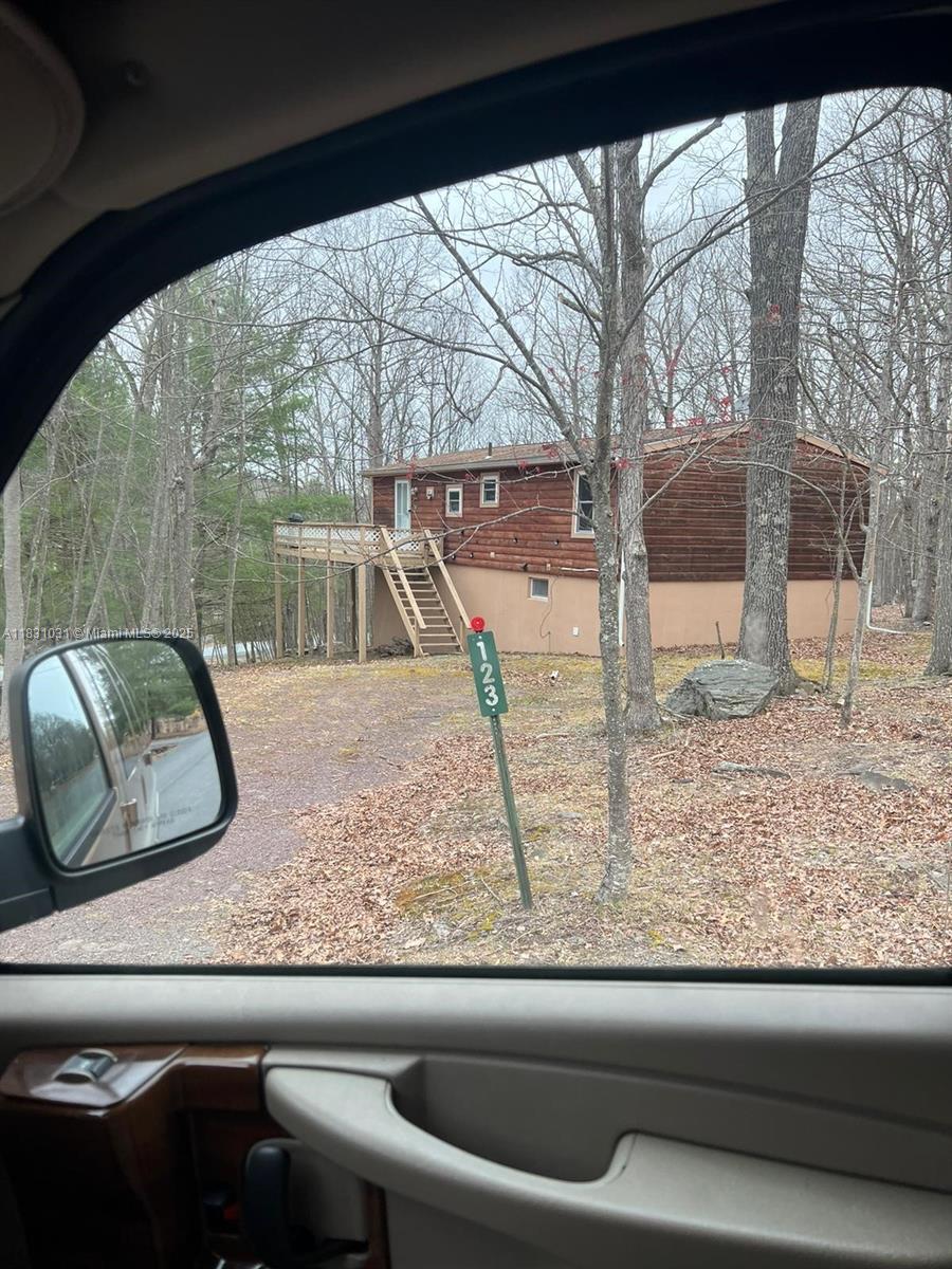 123 Rocky Road Lackawaxen, PA 18435 - Photo 5 of 39 a view of a living room and a window