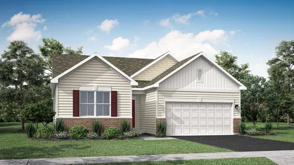 a view of a white house next to a yard and large trees