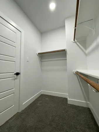 a view of an empty walk in closet