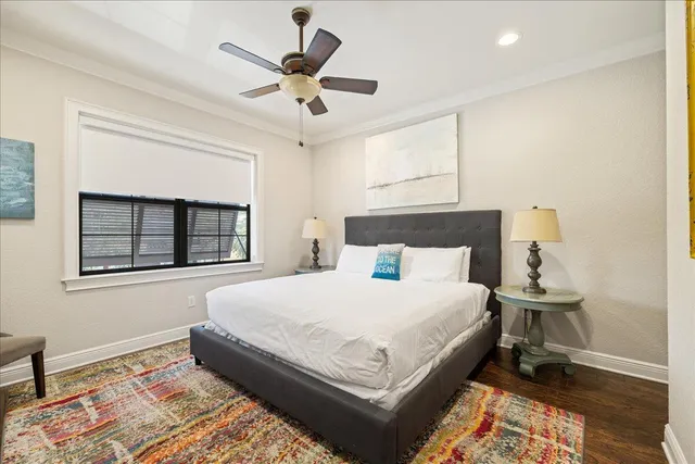 a large bedroom with a bed and a window