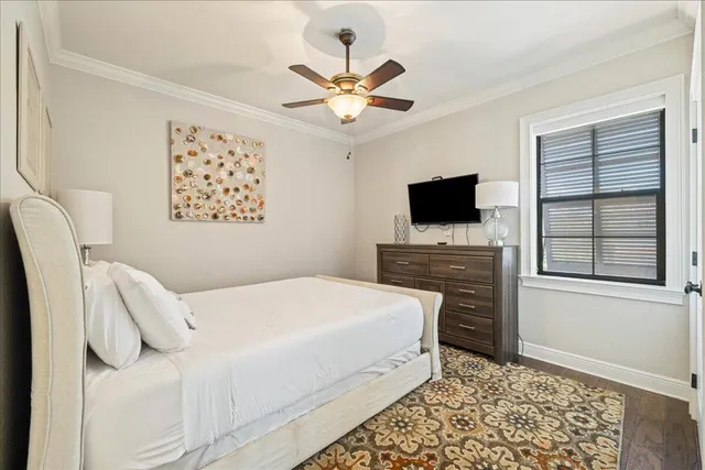 a bedroom with a bed and a television