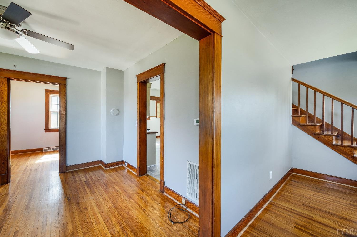 501 West Spencer Road Hurt, VA 24563 - Photo 11 of 55 a view of a hallway with wooden floor and staircase