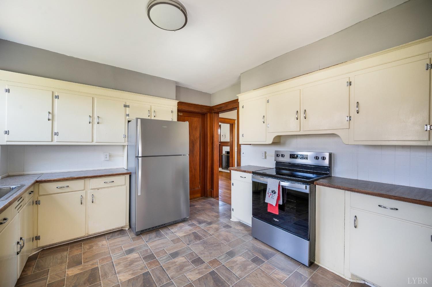 501 West Spencer Road Hurt, VA 24563 - Photo 15 of 55 a kitchen with stainless steel appliances and white cabinets