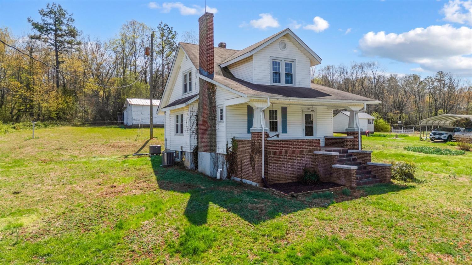 501 West Spencer Road Hurt, VA 24563 - Photo 2 of 55 a view of a house with backyard and porch