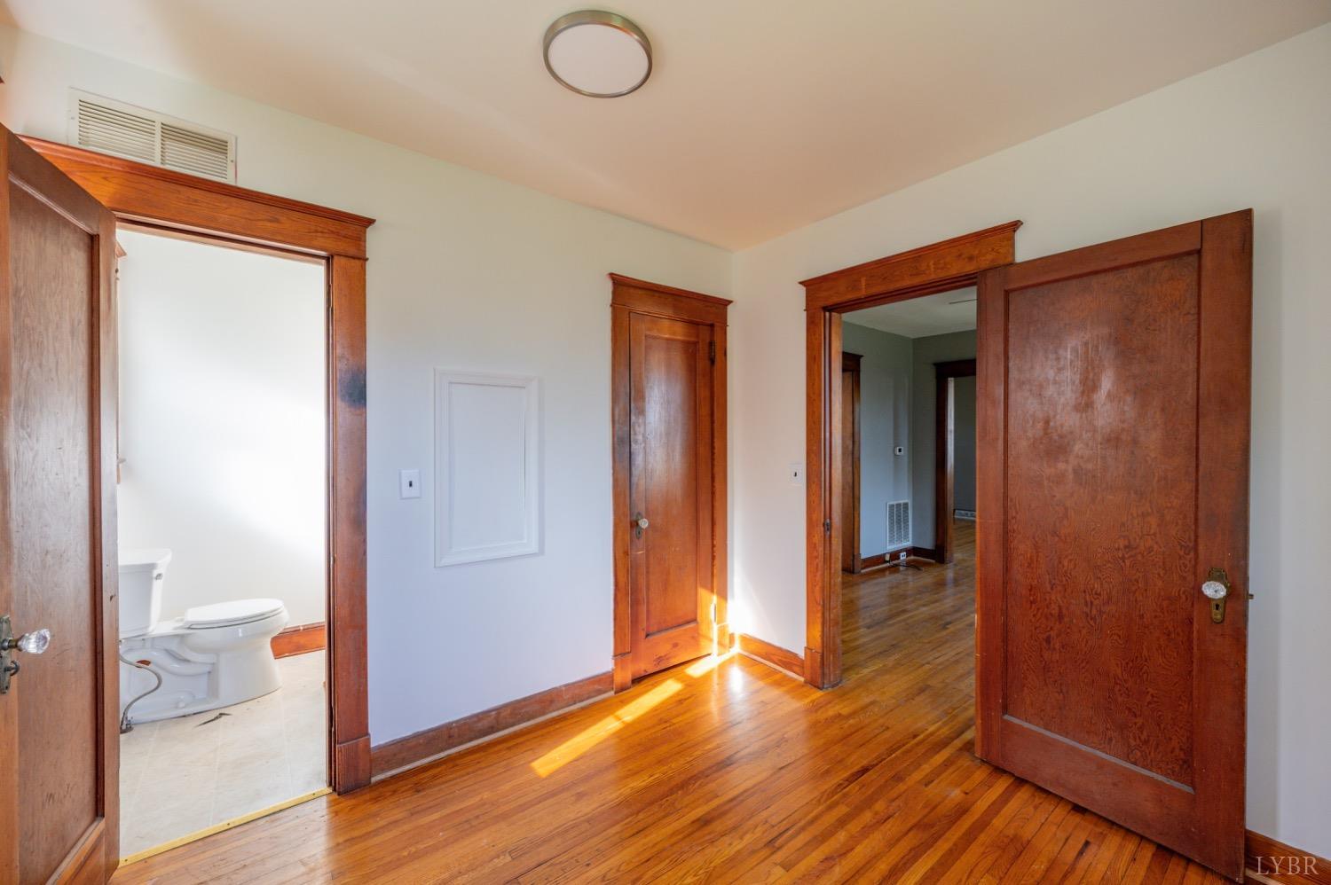 501 West Spencer Road Hurt, VA 24563 - Photo 22 of 55 a view of a hallway with wooden floor and closet area