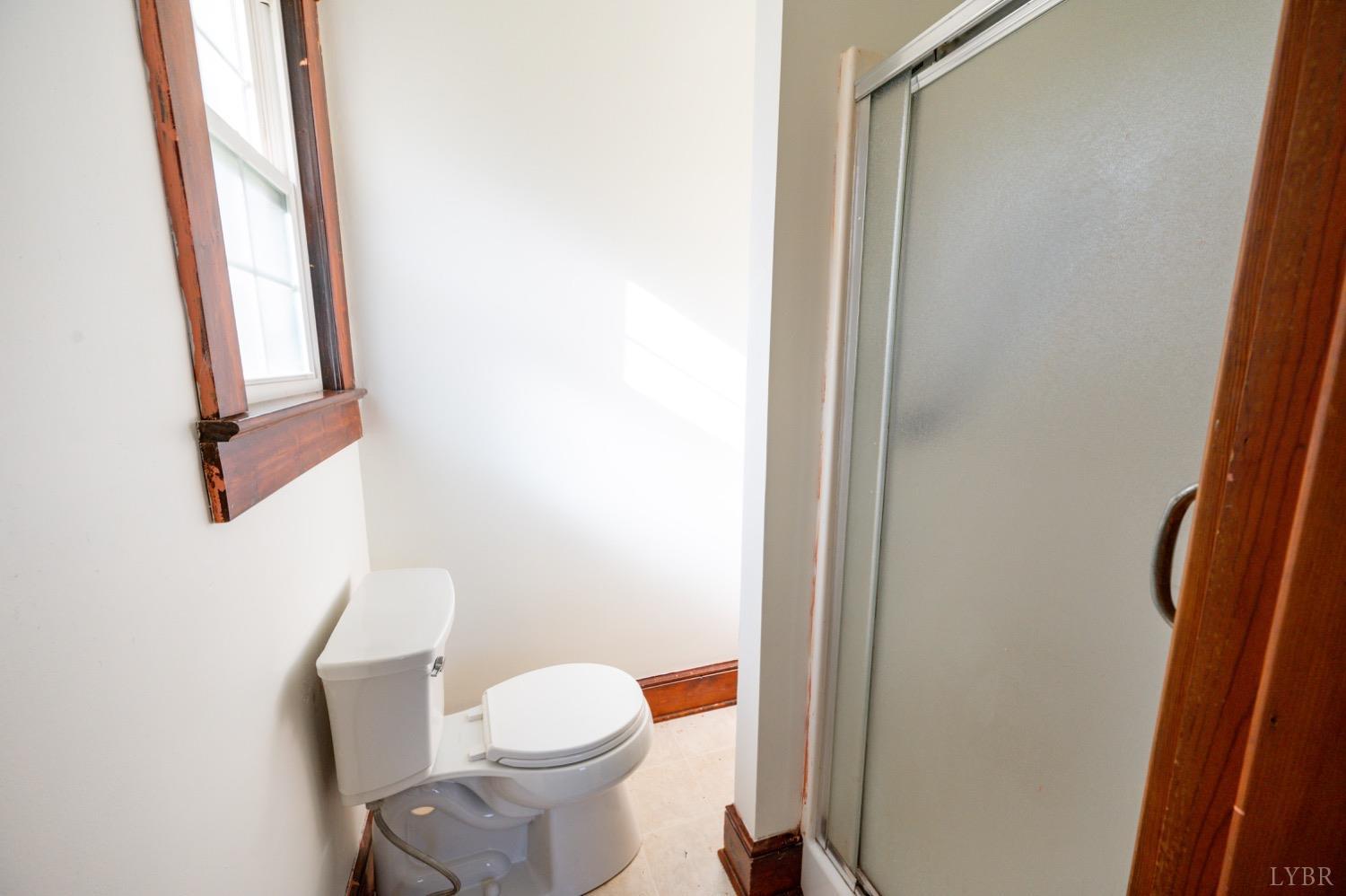 501 West Spencer Road Hurt, VA 24563 - Photo 23 of 55 a white toilet sitting next to a small bathroom