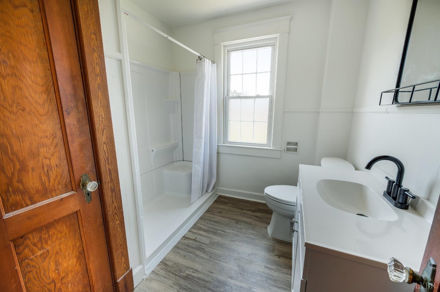 501 West Spencer Road Hurt, VA 24563 - Photo 29 of 55 a bathroom with a sink toilet and shower