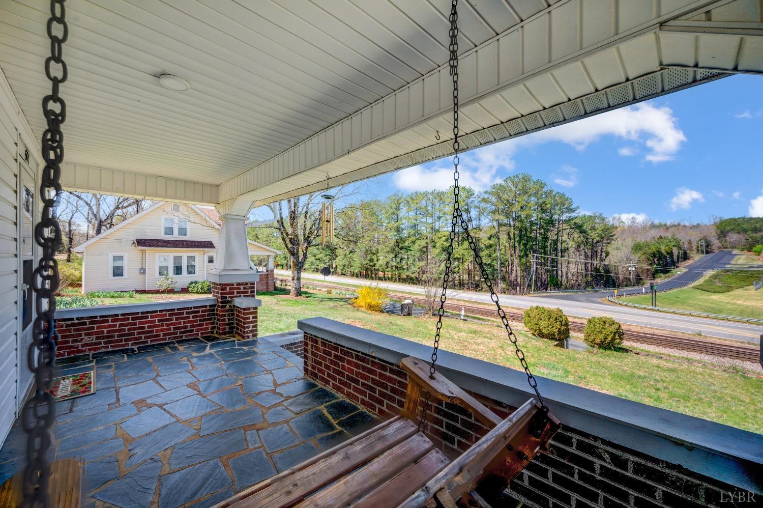 501 West Spencer Road Hurt, VA 24563 - Photo 4 of 55 a outdoor sitting area with swimming pool table and chairs