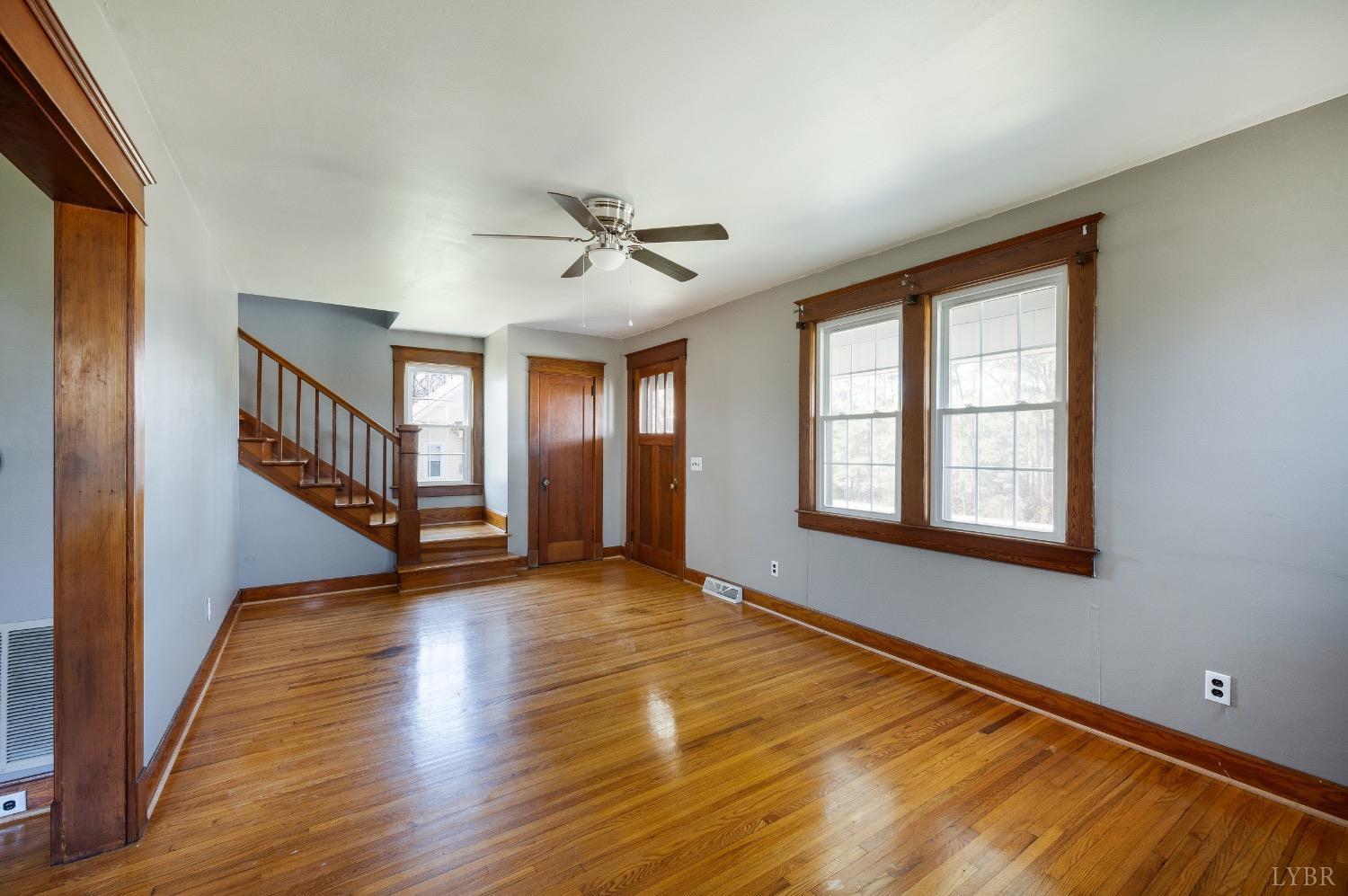501 West Spencer Road Hurt, VA 24563 - Photo 8 of 55 a view of an empty room with wooden floor and a window