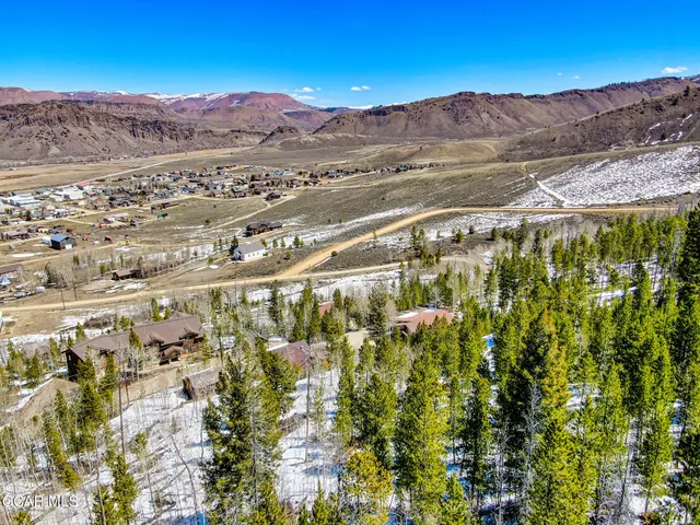 a view of a city with mountains in the background