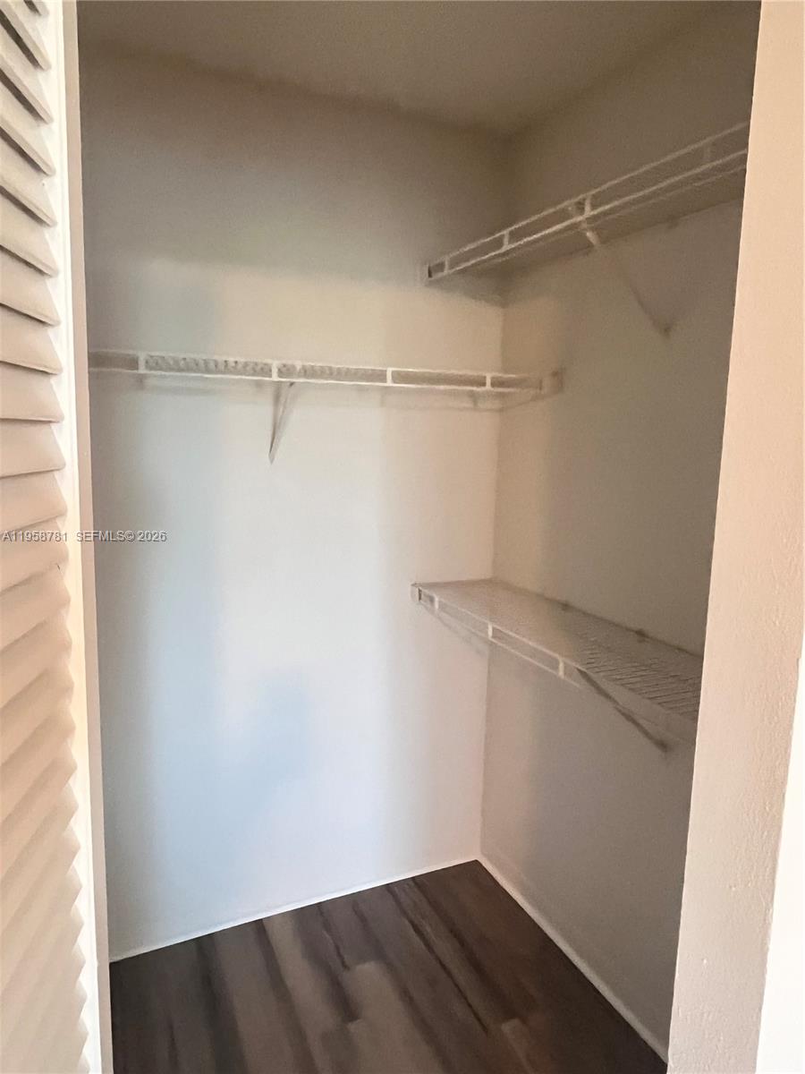 4055 West McNab Road, Unit H211 Pompano Beach, FL 33069 - Photo 11 of 22 a view of a room with racks on the wall