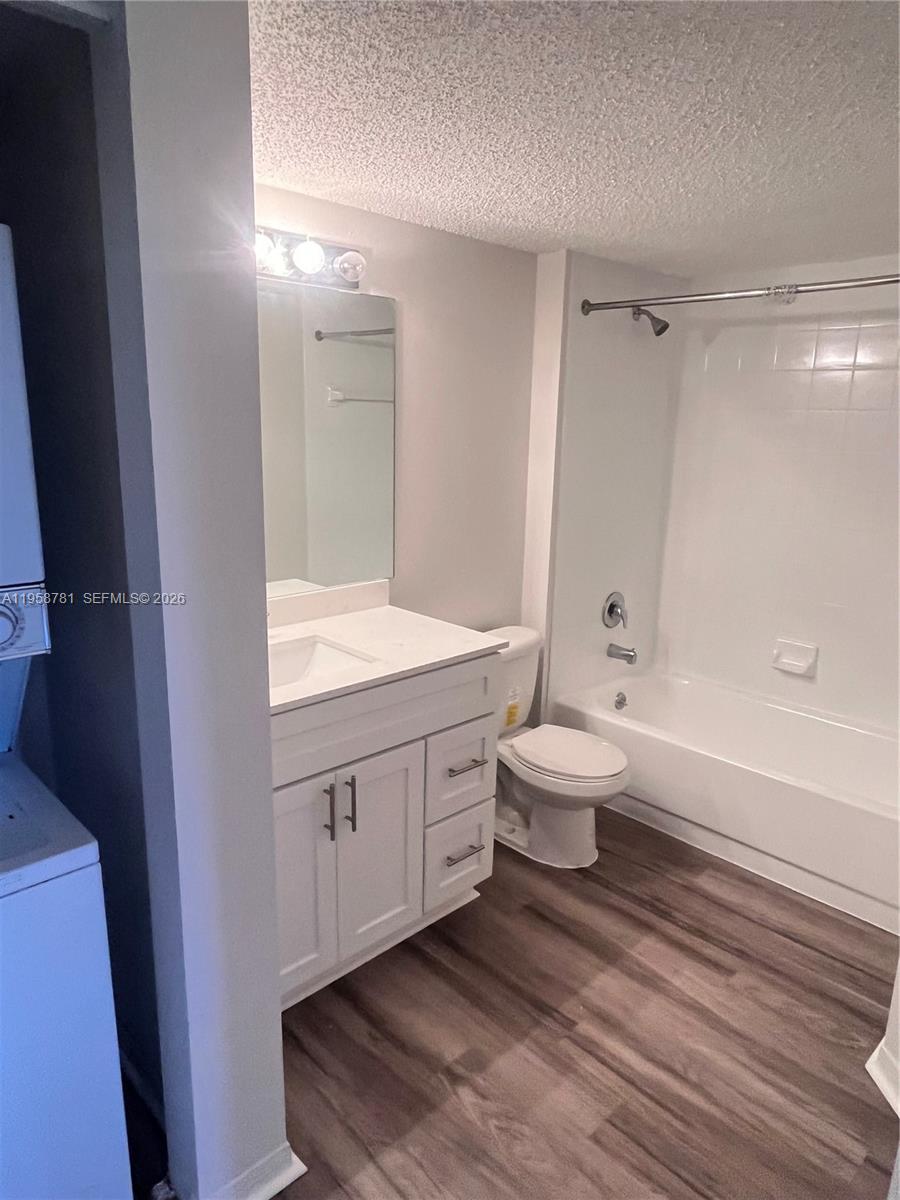 4055 West McNab Road, Unit H211 Pompano Beach, FL 33069 - Photo 12 of 22 a bathroom with a sink a toilet and shower