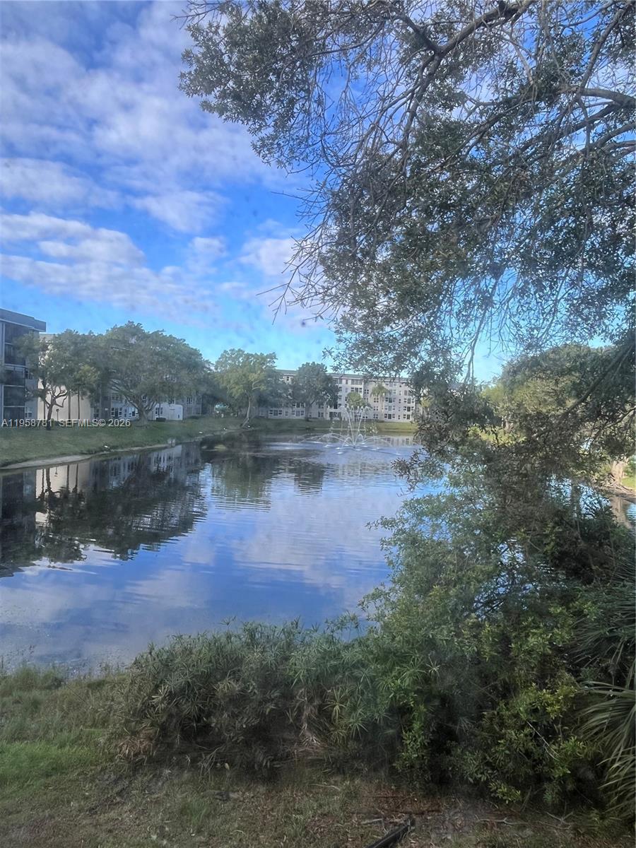 4055 West McNab Road, Unit H211 Pompano Beach, FL 33069 - Photo 14 of 22 a view of a lake with a mountain