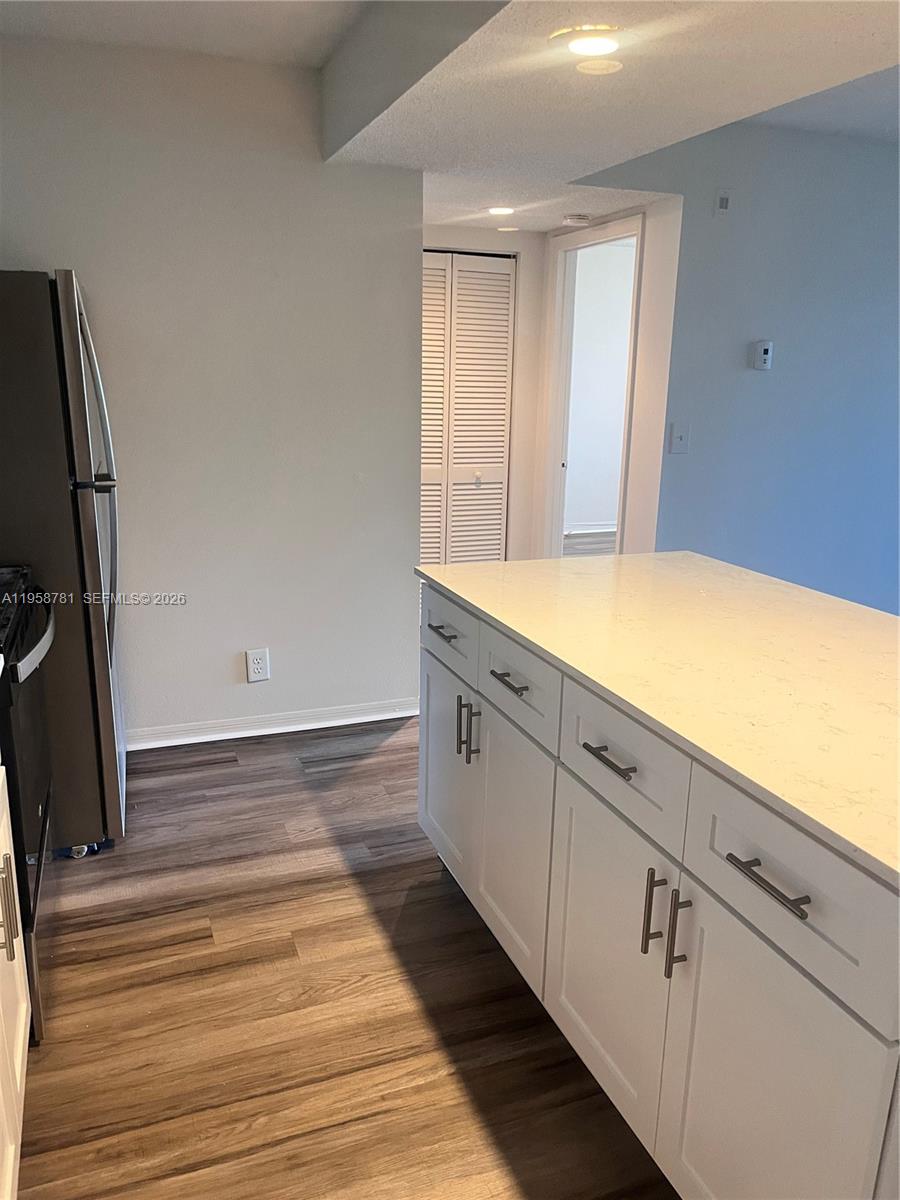 4055 West McNab Road, Unit H211 Pompano Beach, FL 33069 - Photo 5 of 22 a bathroom with a sink and a mirror
