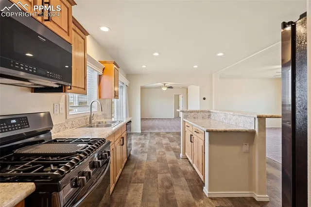a kitchen with a stove and a sink
