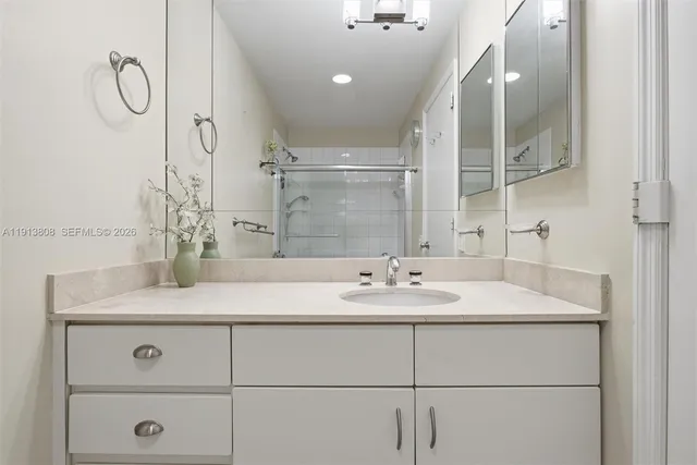 a bedroom with a bed and a television