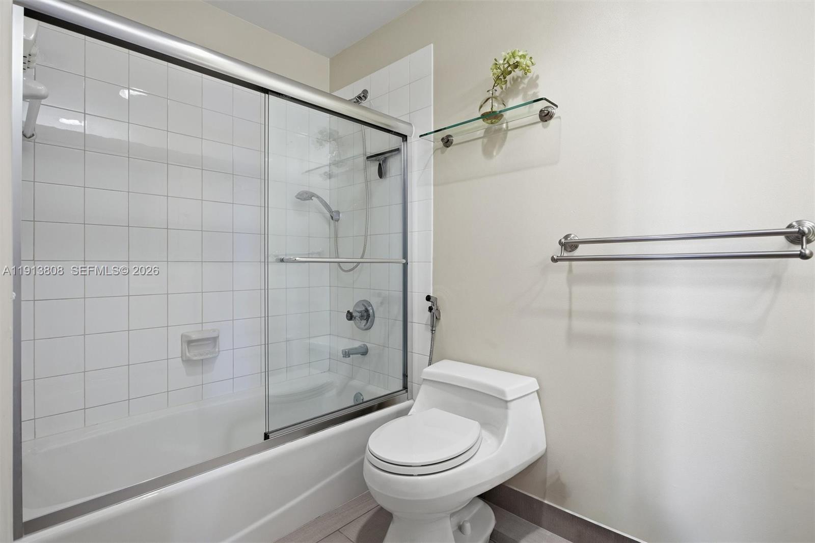 888 Brickell Key Drive, Unit 1903 Miami, FL 33131 - Photo 22 of 38 a bathroom with a shower a toilet and a shower