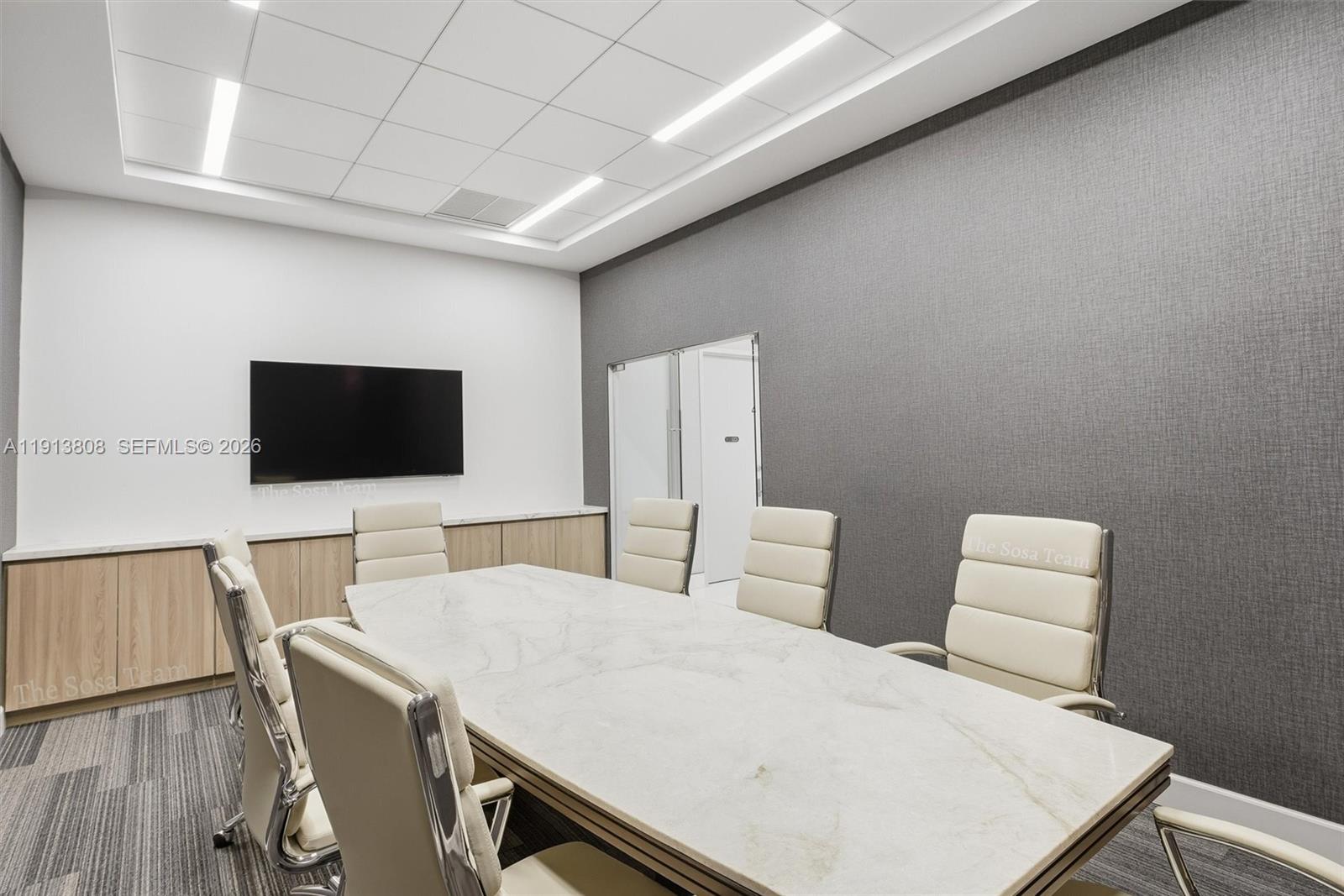 888 Brickell Key Drive, Unit 1903 Miami, FL 33131 - Photo 31 of 38 a living room with furniture and a flat screen tv