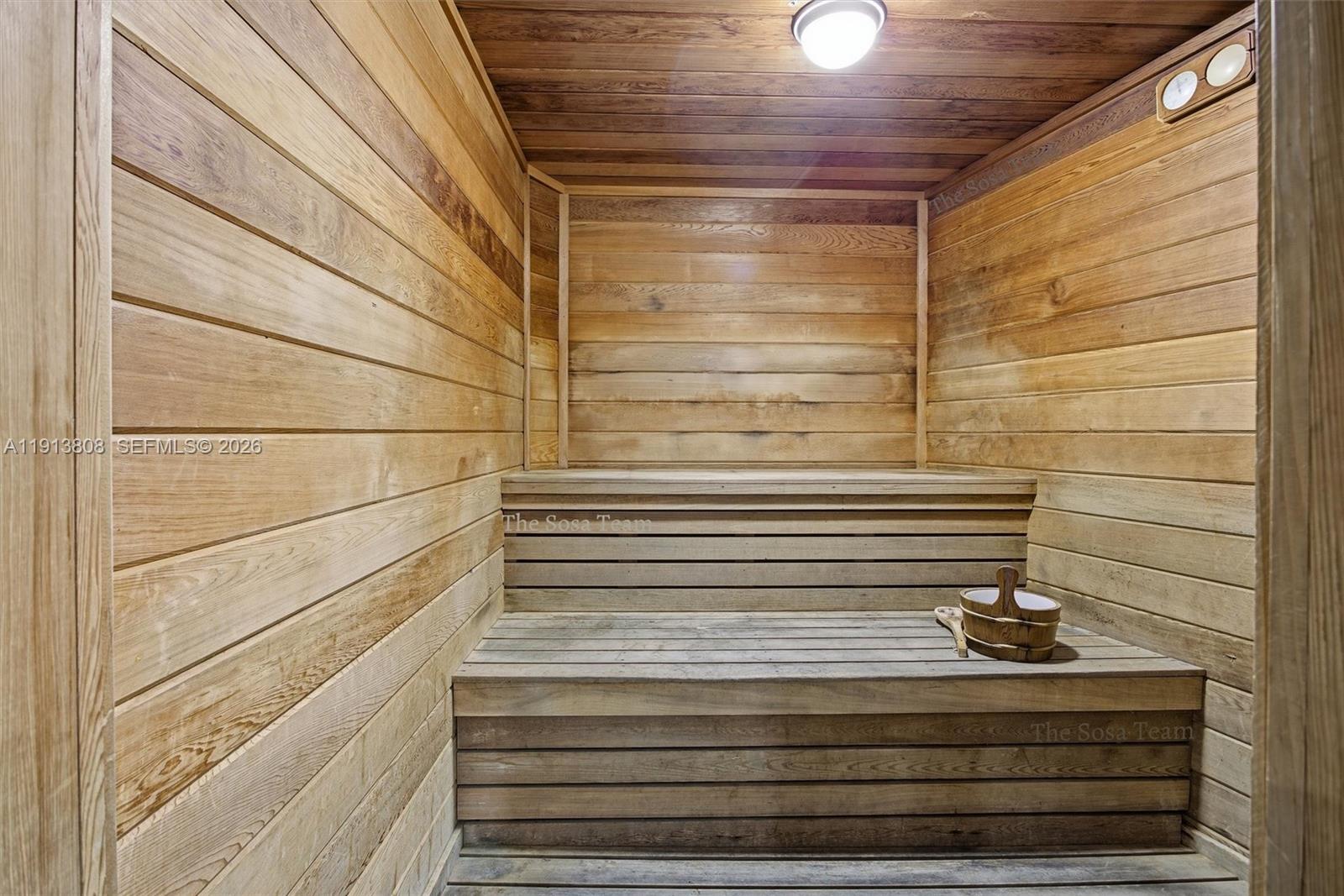 888 Brickell Key Drive, Unit 1903 Miami, FL 33131 - Photo 36 of 38 a bathroom with a sink and mirror