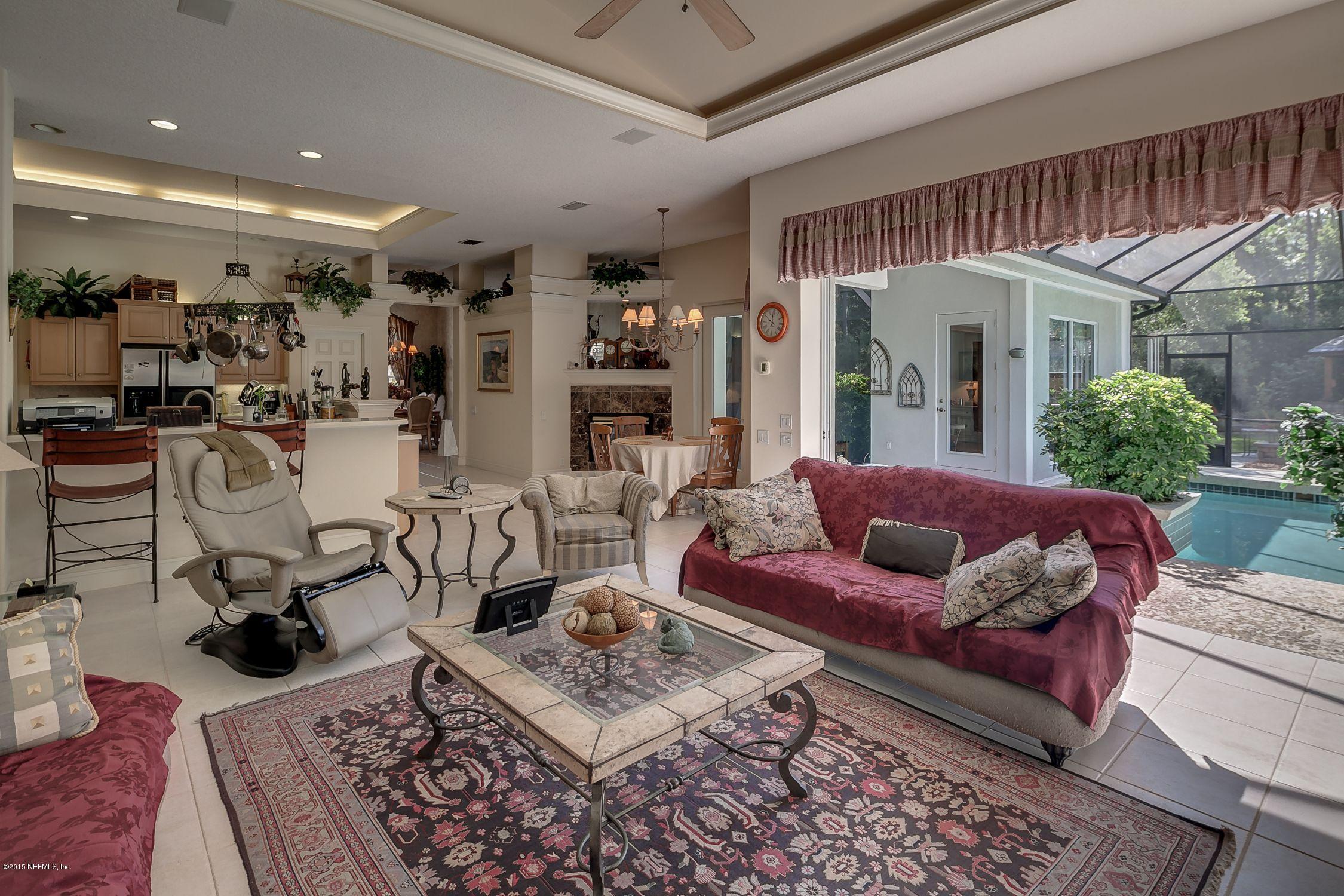 137 Pinehurst Pointe Drive St. Augustine, FL 32092 - Photo 11 of 48 a living room with furniture and a table