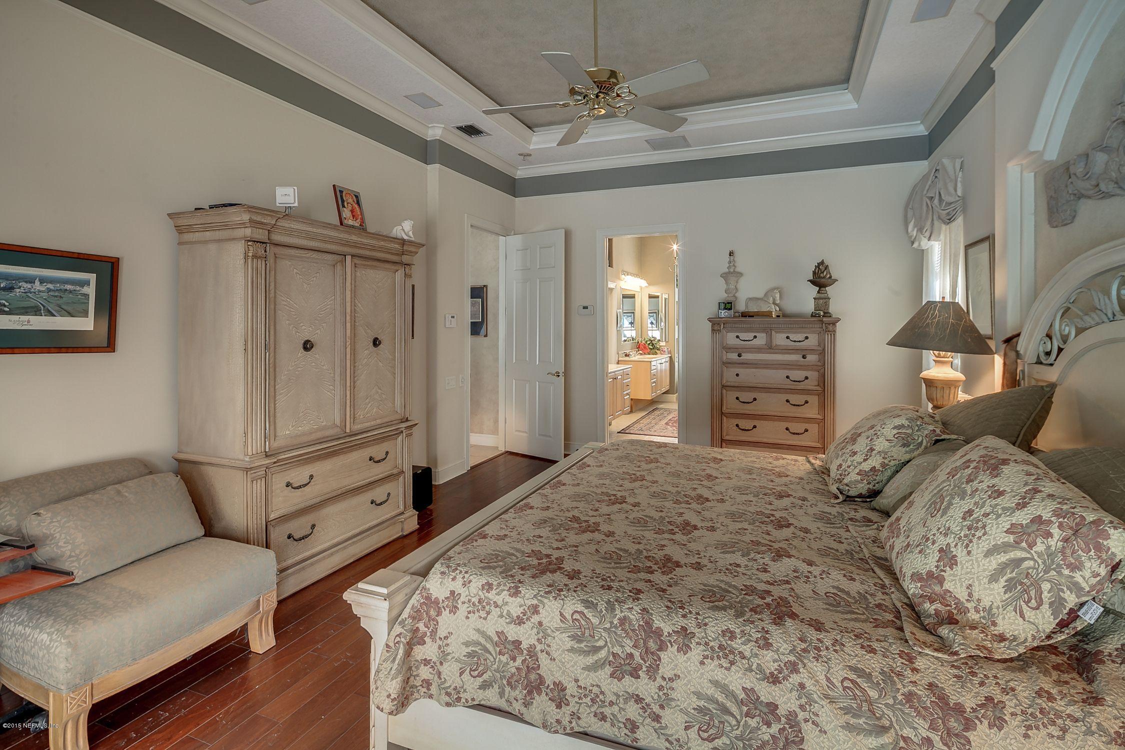 137 Pinehurst Pointe Drive St. Augustine, FL 32092 - Photo 17 of 48 a bedroom with a bed and a couch