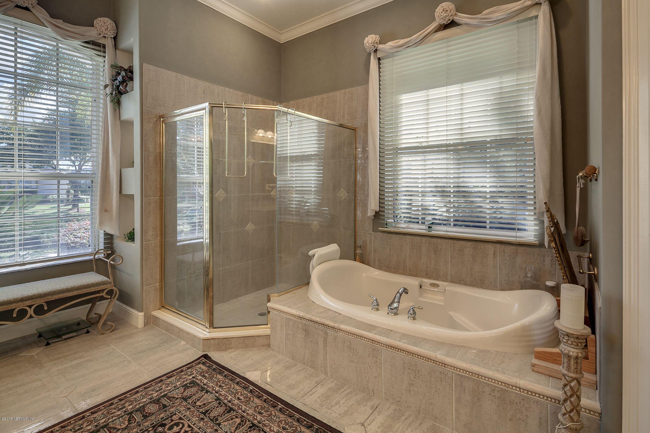 137 Pinehurst Pointe Drive St. Augustine, FL 32092 - Photo 20 of 48 a bathroom with a bathtub and shower