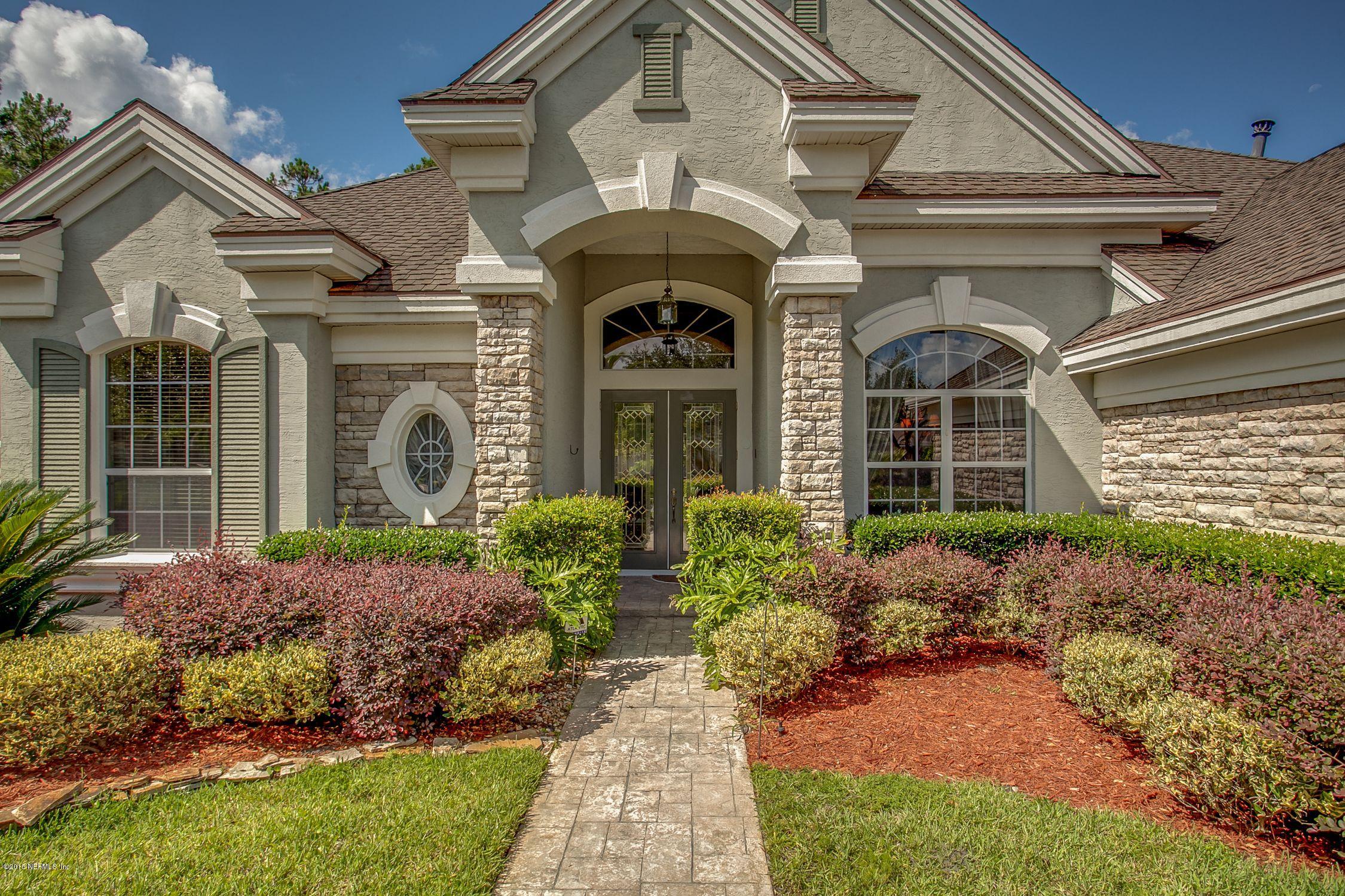 137 Pinehurst Pointe Drive St. Augustine, FL 32092 - Photo 2 of 48 a front view of a house with garden