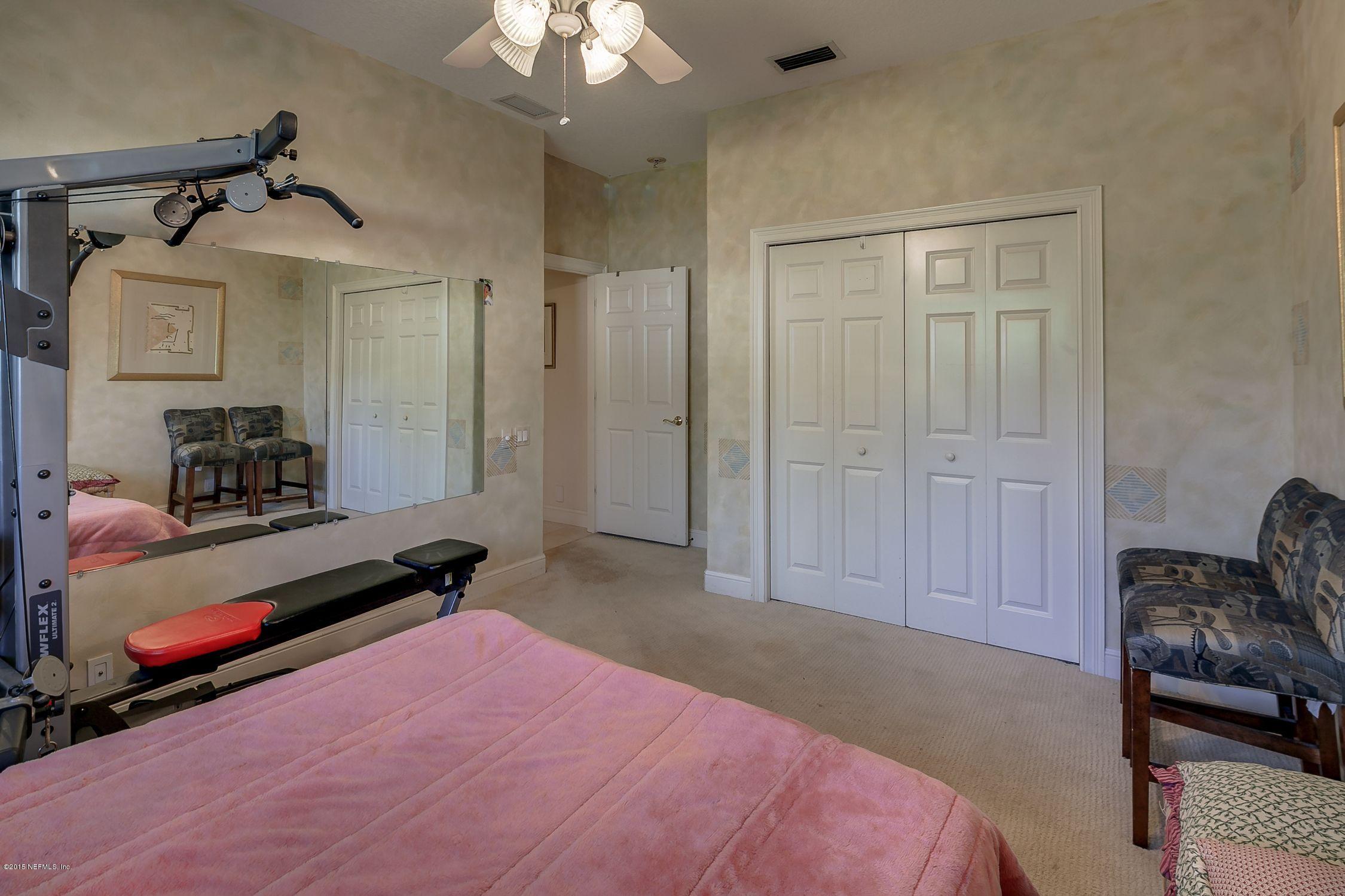 137 Pinehurst Pointe Drive St. Augustine, FL 32092 - Photo 24 of 48 a bedroom with bed and window