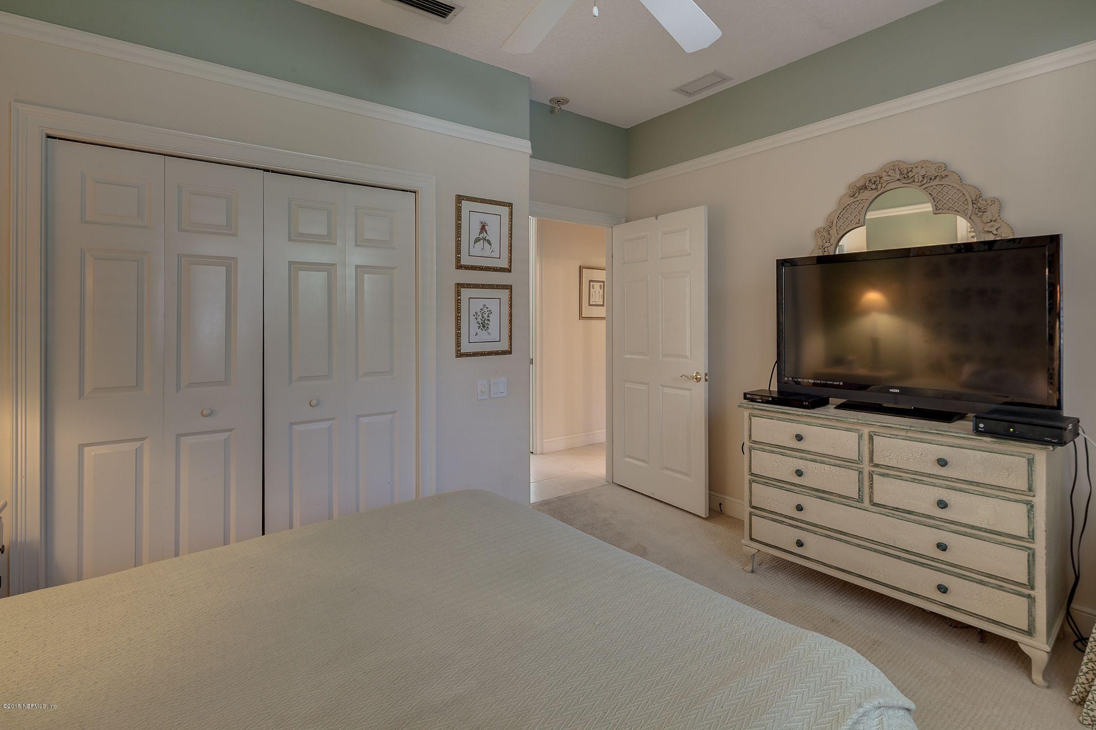 137 Pinehurst Pointe Drive St. Augustine, FL 32092 - Photo 28 of 48 a room with a flat screen tv and cabinets