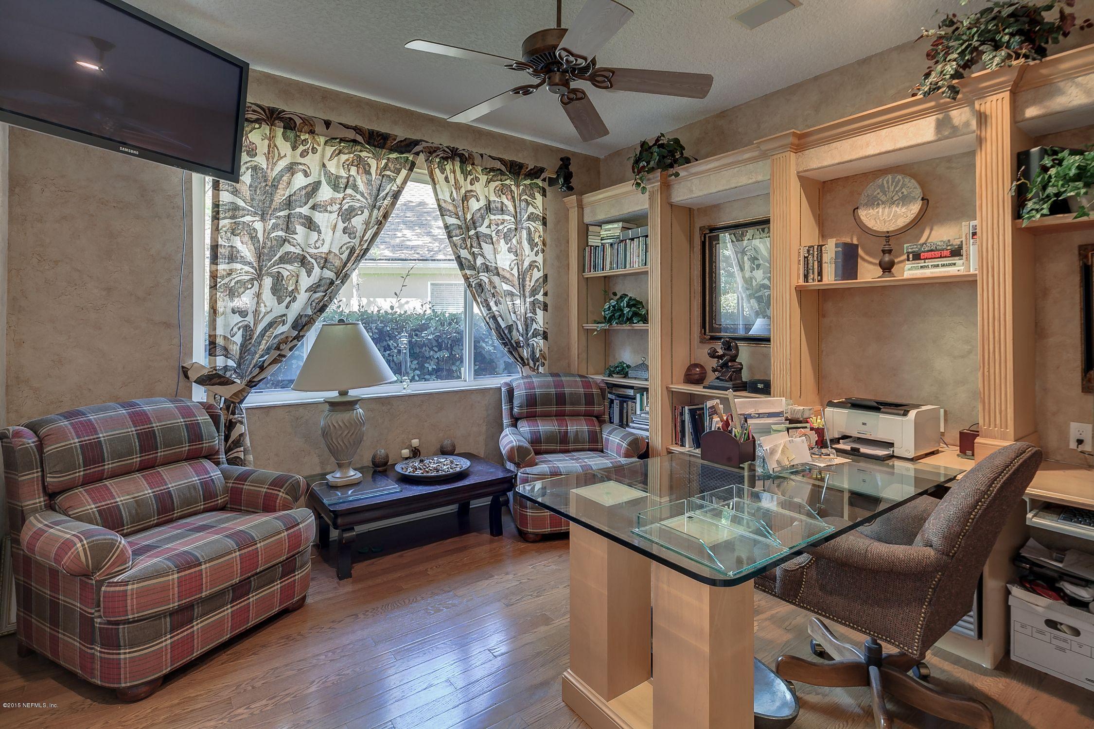 137 Pinehurst Pointe Drive St. Augustine, FL 32092 - Photo 30 of 48 a living room with furniture and a window