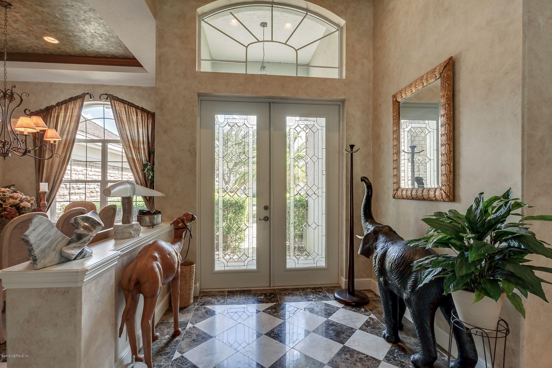 137 Pinehurst Pointe Drive St. Augustine, FL 32092 - Photo 3 of 48 a view of a entryway with furniture and floor to ceiling window