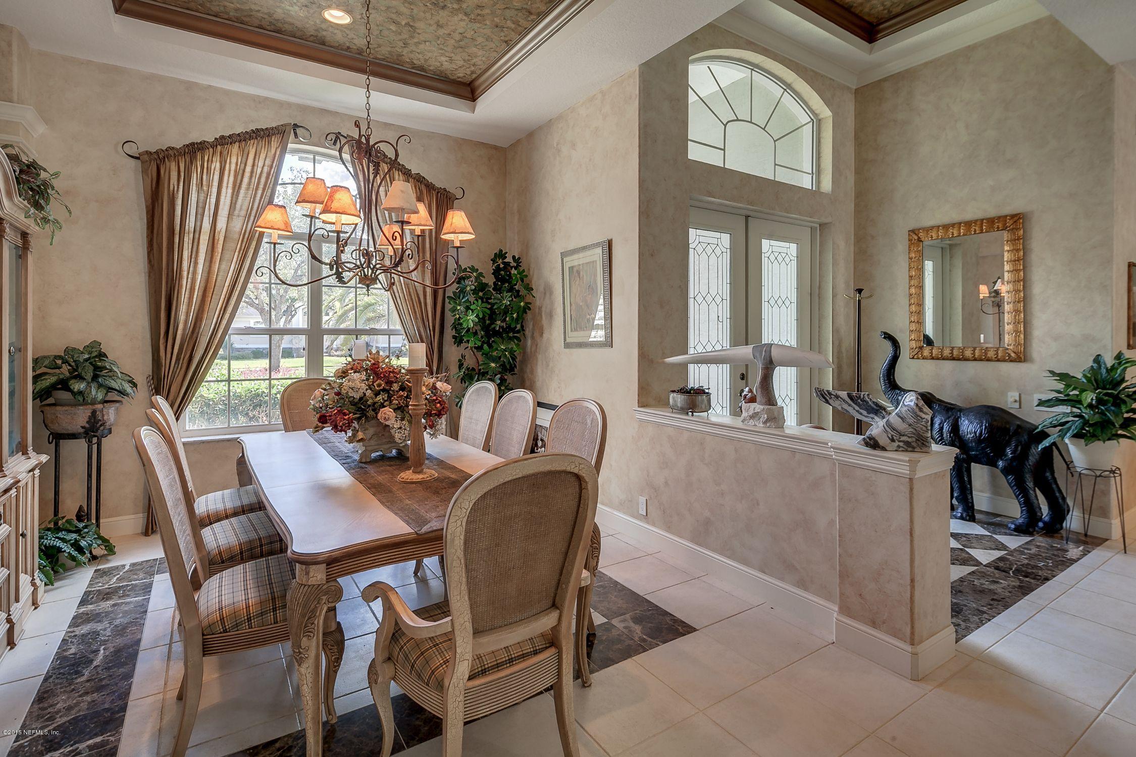 137 Pinehurst Pointe Drive St. Augustine, FL 32092 - Photo 4 of 48 a dining room with furniture a chandelier and window