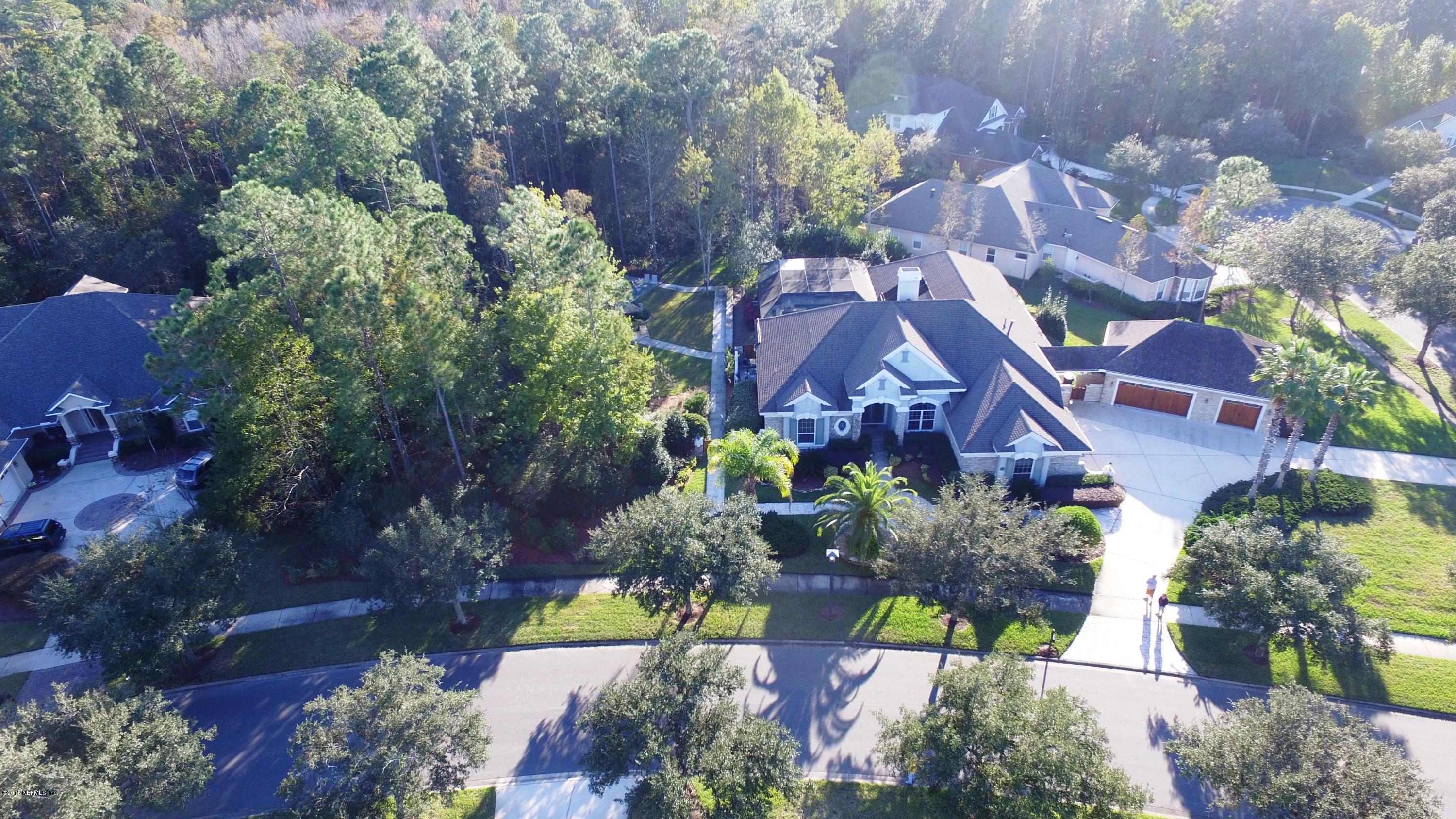 137 Pinehurst Pointe Drive St. Augustine, FL 32092 - Photo 41 of 48 an aerial view of a house with a yard and a large tree