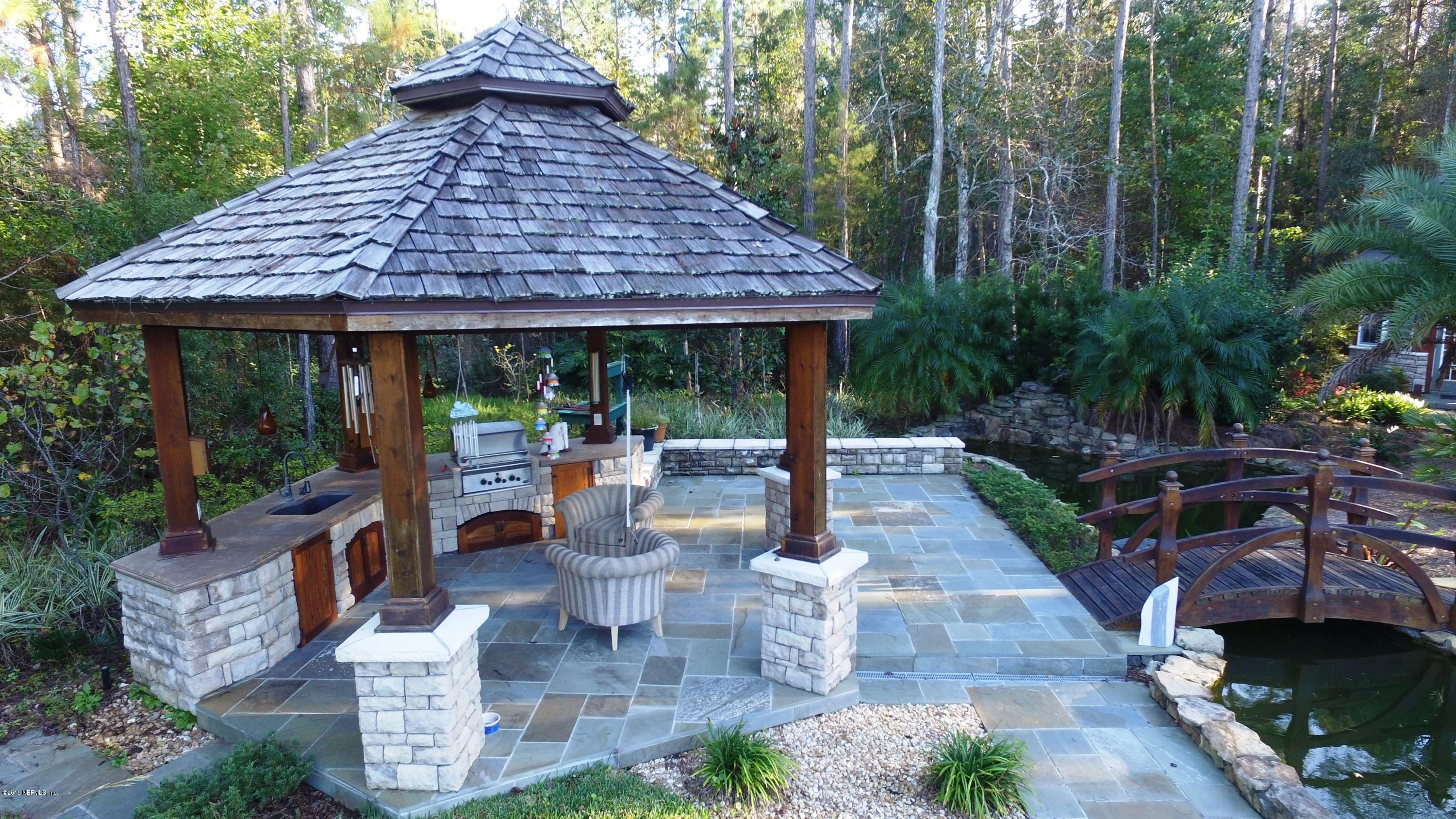 137 Pinehurst Pointe Drive St. Augustine, FL 32092 - Photo 45 of 48 a view of a table and chairs in patio