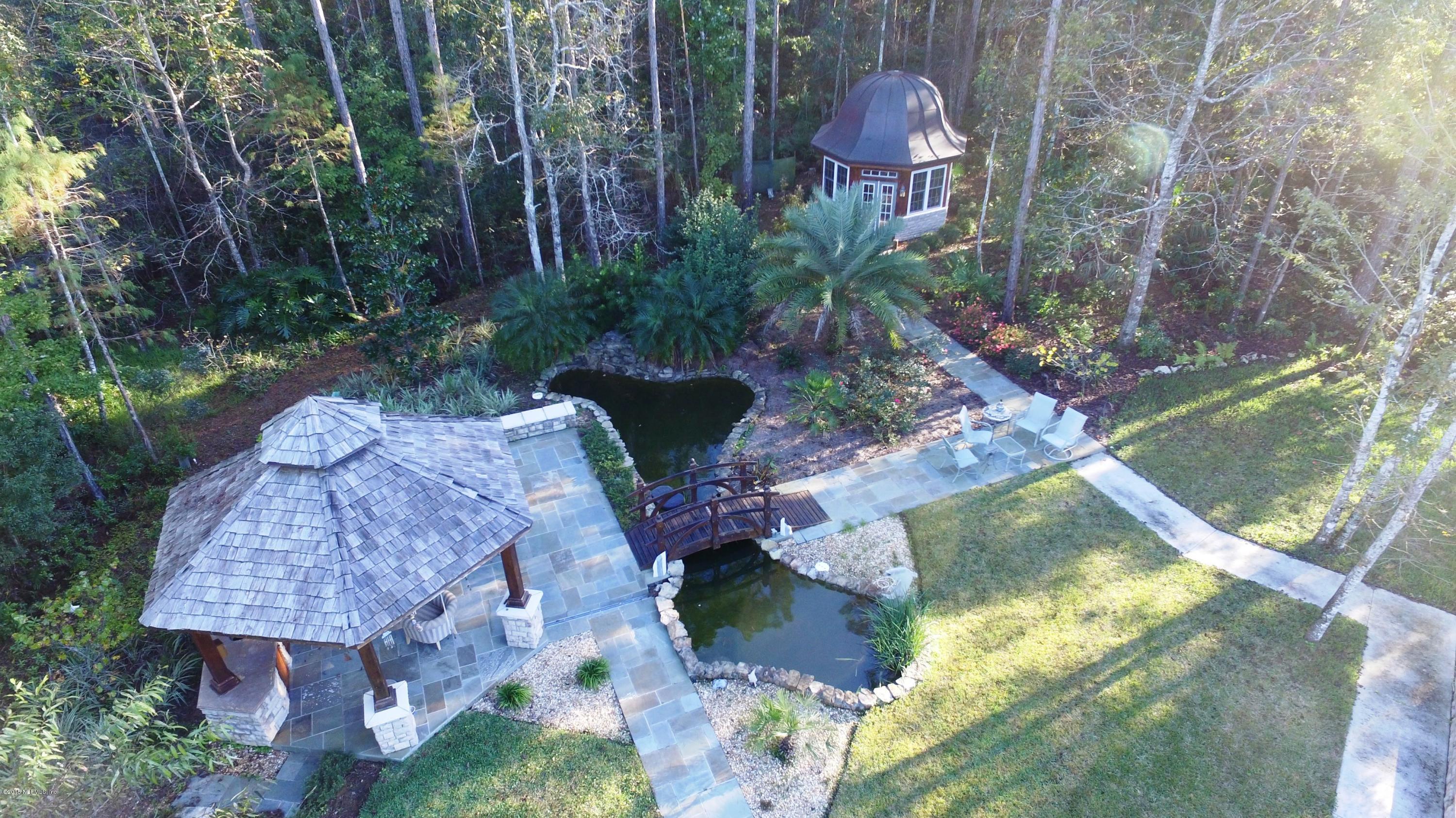 137 Pinehurst Pointe Drive St. Augustine, FL 32092 - Photo 48 of 48 a backyard of a house with lots of green space